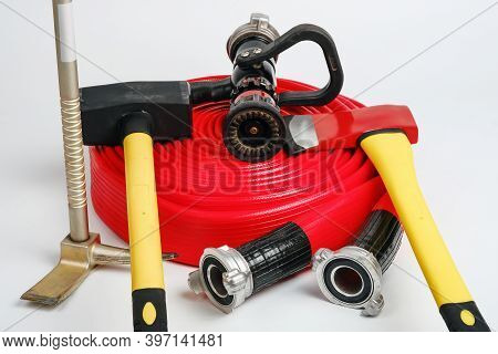 Red Rolled Fire Hose, Hooligan Pinch-bar, Large Yellow Sledgehammer And Axe From Firefighters Toolbo