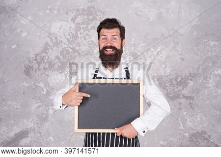 Cheerful Hospitable Restaurant Waiter With Chalkboard, Copy Space. Best Choice. Advertisement And Fo