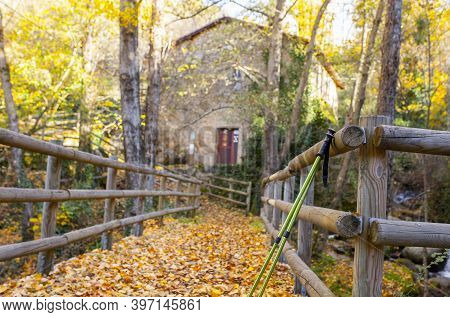 Trekking Poles At Old Banos De Montemayor Watermill. Magic Autumn Of Ambroz Valley, Extremadura, Spa