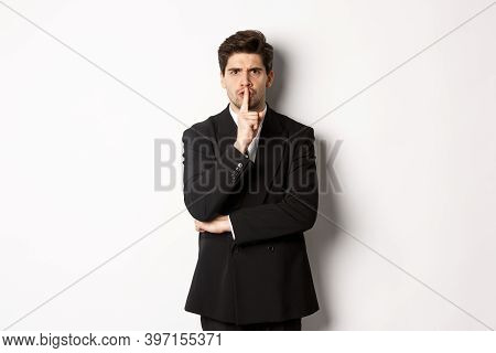 Portrait Of Angry Boss In Suit Shushing At You, Telling To Be Quiet, Showing Taboo Hush Sign And Fro