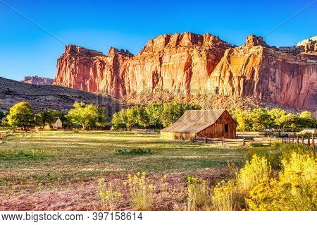 Landscape With Monumental Old Barn In Fruita At Sunset, Capitol Reef National Park, Utah, Usa
