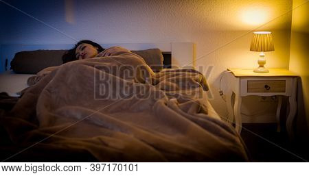 Young Asian Woman Wakes Up While She Lies In Bed - Home Shooting