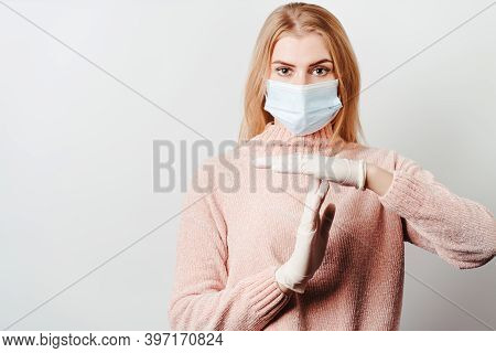 Confident Woman In Medical Mask Showing T Sign With Hands. Quarantine Restrictions, Time Out, End Co