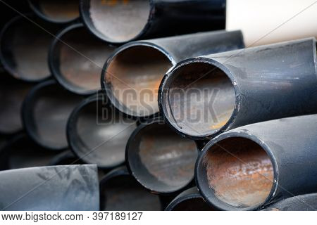 Black Metal Pipes And Adapters Of Different Diameters For Gasification Or Water Supply. Industrial B