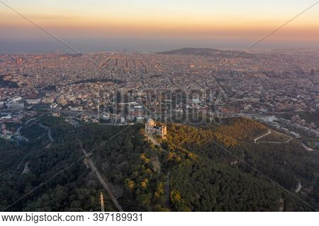 Aerial Drone Shot Of Tibidabo Mountain With City View Of Barcelona