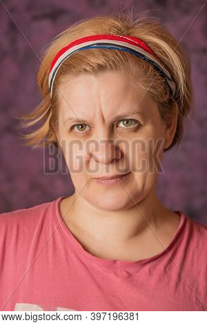 Woman's Portrait On The Abstract Background.
