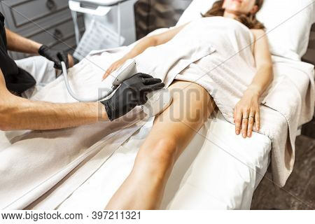 Determining The Amount Of Sebum On Female Leg Using Medical Caliper, Close-up