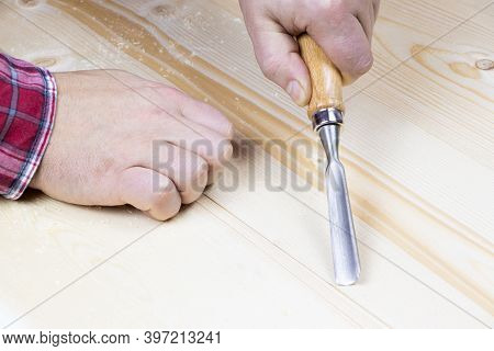 Chisels. Assortment Of Chisel Of Wood For Carpentry. Hand Holding Chisel.
