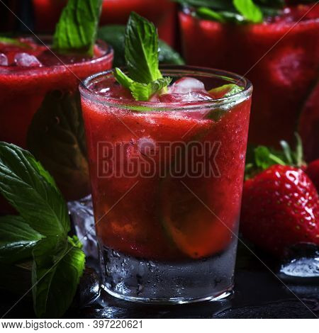 Alcoholic Cocktail Strawberry Mojito With Rum, Syrup, Soda, Lime, Mint And Ice, Selective Focus