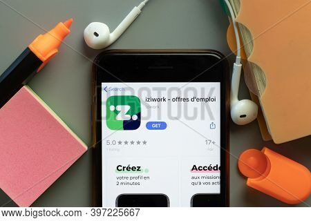 New York, Usa - 1 December 2020: Iziwork Mobile App Icon On Phone Screen Top View, Illustrative Edit