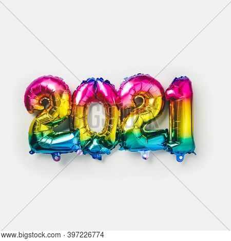 Rainbow colored Foil balloons in the form of numbers 2021. New year celebration