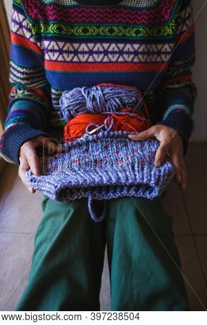 Female Hands Close-up, Young Woman Is Knitting. Knitting Needles And Threads. Multi-colored Yarn. Ha