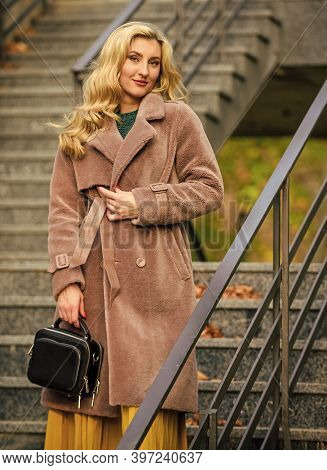 Any Weather Is Good. Autumn Season. European Winter. Girl Warm Coat Stairs Background. Faux Fur Coat