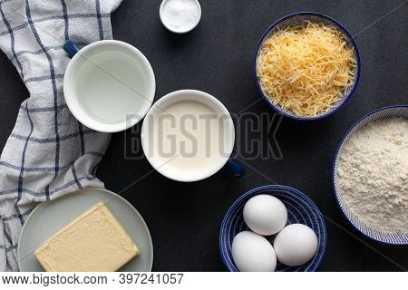 Ingredients For Traditional French Gougeres - Savory Cheese Pastry: Flour, Eggs, Butter, Milk, Water