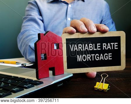 The Realtor Offers Variable Rate Mortgage And Holds Plate.