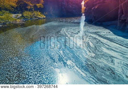 Mountain Landscape. Aerial View Of A Mountain River In Early Spring. Abstract Pattern Of Foam On The