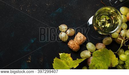 Champagne In Glasses, Grapes With Vine, Black Background, Top View
