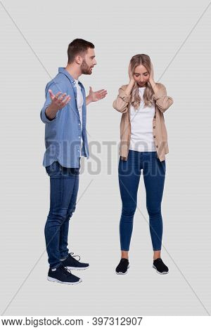 Couple Having A Fight. Man Screaming At Girl. Man Is Not Satisfied. Couple Standing Isolated. Girl C
