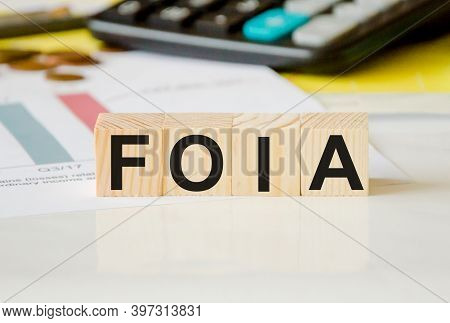 Focused On The Business Concept. The Word Foia Is Written On Wooden Cubes On A White Background From
