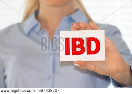 The Doctor Holds A Card With The Abbreviation Ibd In His Hands.
