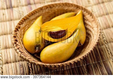 Eggfruit Or Canistel In A Basket, Thai Fruit, In Thai Names Such As Xiantao, Lamut Khamen Or Mon Kha