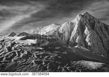 Winter alpine landscape in National Park Retezat, Carpathians, Romania, Europe. Snow covered moutains scenery