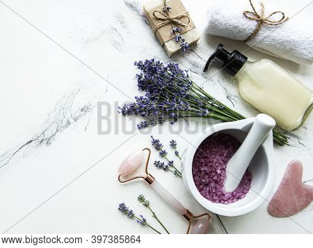 Flat Lay Composition With Lavender Flowers And Natural Cosmetic On Marble Background