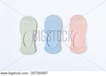 Top View Pair Of Woman Short Sock Or Ankle Sock Or Pile Footsies In Pastel Color On White Background