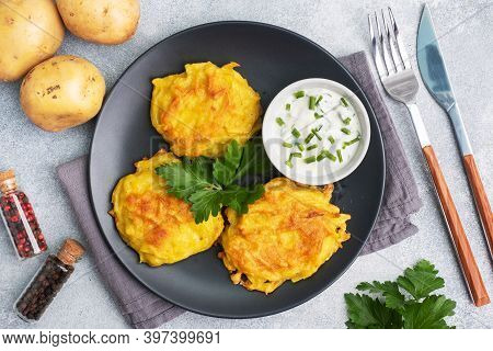 Fried Cakes Of Grated Potatoes On The Plate With Sauce. Traditional Pancakes Boxty Raggmunk.