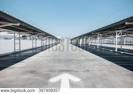 Car Parking Lot Area On Deck Floor Of Shopping Mall, Perspective View Empty Of Car Park Structure Bu