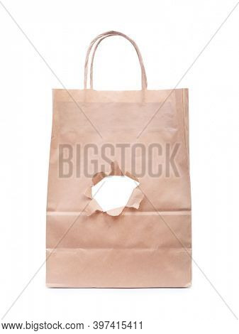 Paper bag with a torn hole isolated on white background
