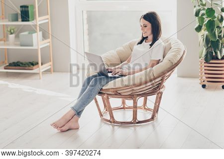 Full Size Photo Of Young Lady Sitting On Wicker Chair Working Laptop Wear White T-shirt Denim In Hou