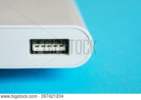 Usb Upstream Port On A Modern Gadget: Power Bank Or Laptop Dongle. Blue Background. Close-up. Free S