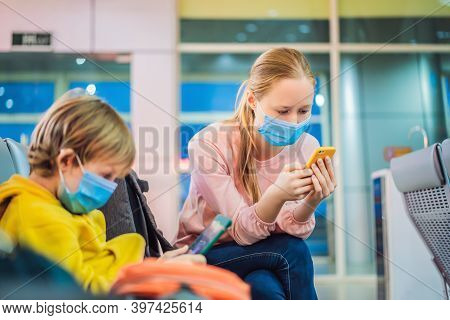 Family With Kids In Face Mask In Shopping Mall Or Airport. Mother And Child Wear Facemask During Cor