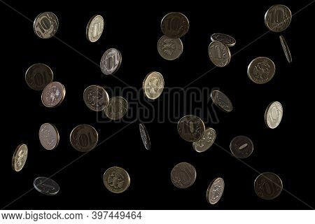 Russian Money. Falling Rubles, The Face Value Of 10 Rubles. Coins On A Black Background. Frozen Fall