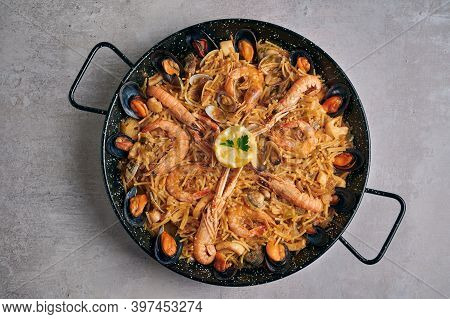 Fideua, Noodle Paella With Seafood On Rustic Background, Top View
