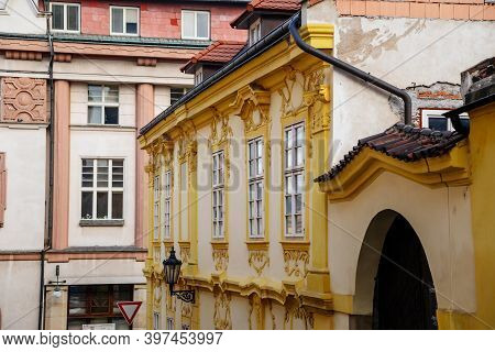 Narrow Picturesque Street With Colorful Buildings In Old Historic Center Of Kolin, Yellow House With