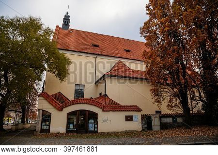 Yellow Baroque Church Of The Holy Trinity In Old Historic Center Of Kolin In Autumn Day, Central Boh