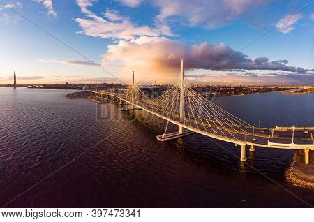 Aerial Panoramic View To Evening St. Petersburg And Cable-stayed Bridge Across Petrovsky Fairway. We