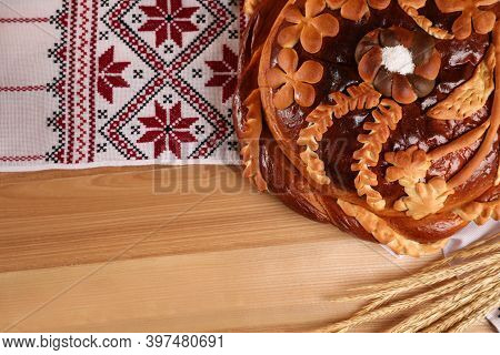 Rushnyk With Korovai, Wheat Spikes On Wooden Table, Flat Lay. Ukrainian Bread And Salt Welcoming Tra