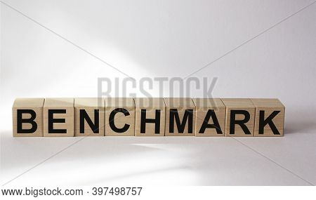 The Word Etalon Is Written On Wooden Cubes And A White Background.