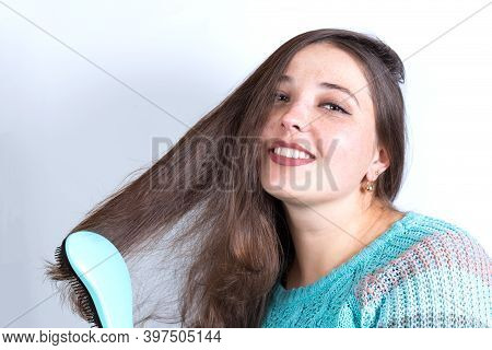 Smiling Combing Girl. Girl Preparing For Date.