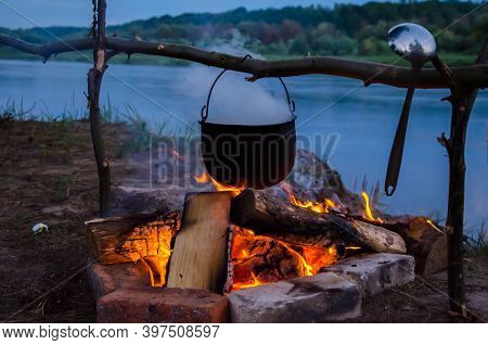 Camping Cauldron. Cauldron At The Stake. Rest By The River