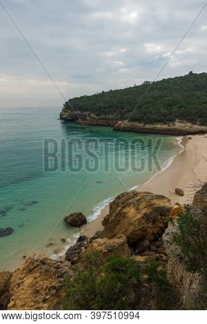 Paradise Idylic Coelhos Beach With Turquoise Water In Arrabida Park, In Portugal