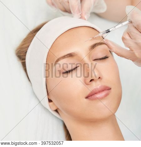 Forehead Injection At Spa Salon. Doctor Hands. Closeup. High Quality. Pretty Female Patient. Beauty 