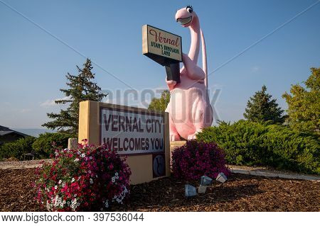 Vernal, Utah - September 24, 2020: Sign For Vernal Utah, With Its Famous Pink Dinosaur Statue, Taken