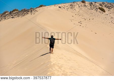 Sotovento, Fuerteventura, Spain: 2020 October 8: Young Man Walks Through The Dunes At Playa De Sotav
