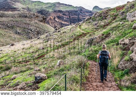 Girl Hiking Rocky Cliffs Clear Near Water Of Atlantic Ocean Bay Ponta De Sao Lourenco, The Island Of