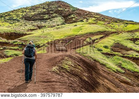 Girl Hiking Rocky Cliffs Clear Near Water Of Atlantic Ocean Bay Ponta De Sao Lourenco, The Island Of