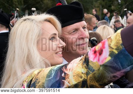 Moscow,museon Park,september 4, 2016: A Pretty Smiling Young Blonde Takes A Selfie With A Musician F